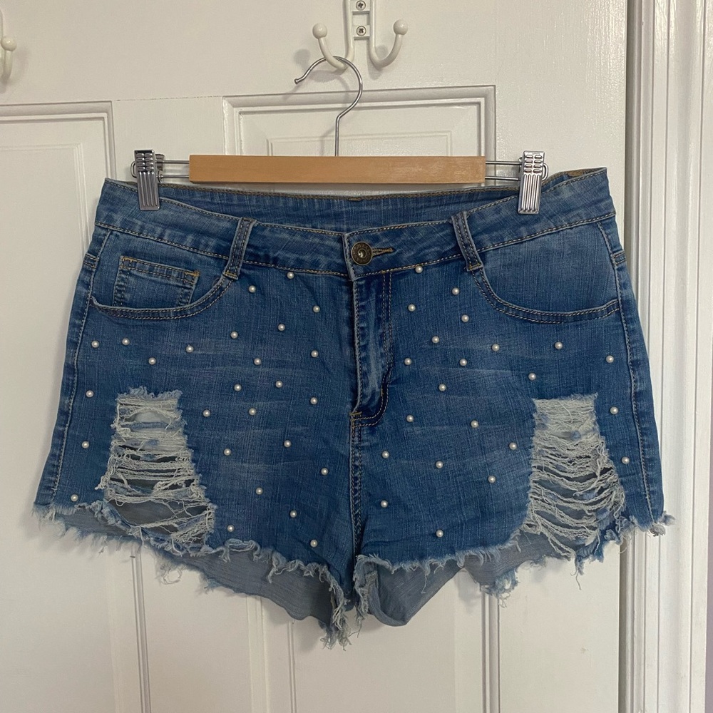 Women’s jean shorts with pearl studs on